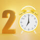 2021 with an alarm clock standing in for the zero