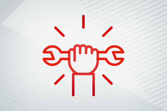 A hand holding a wrench