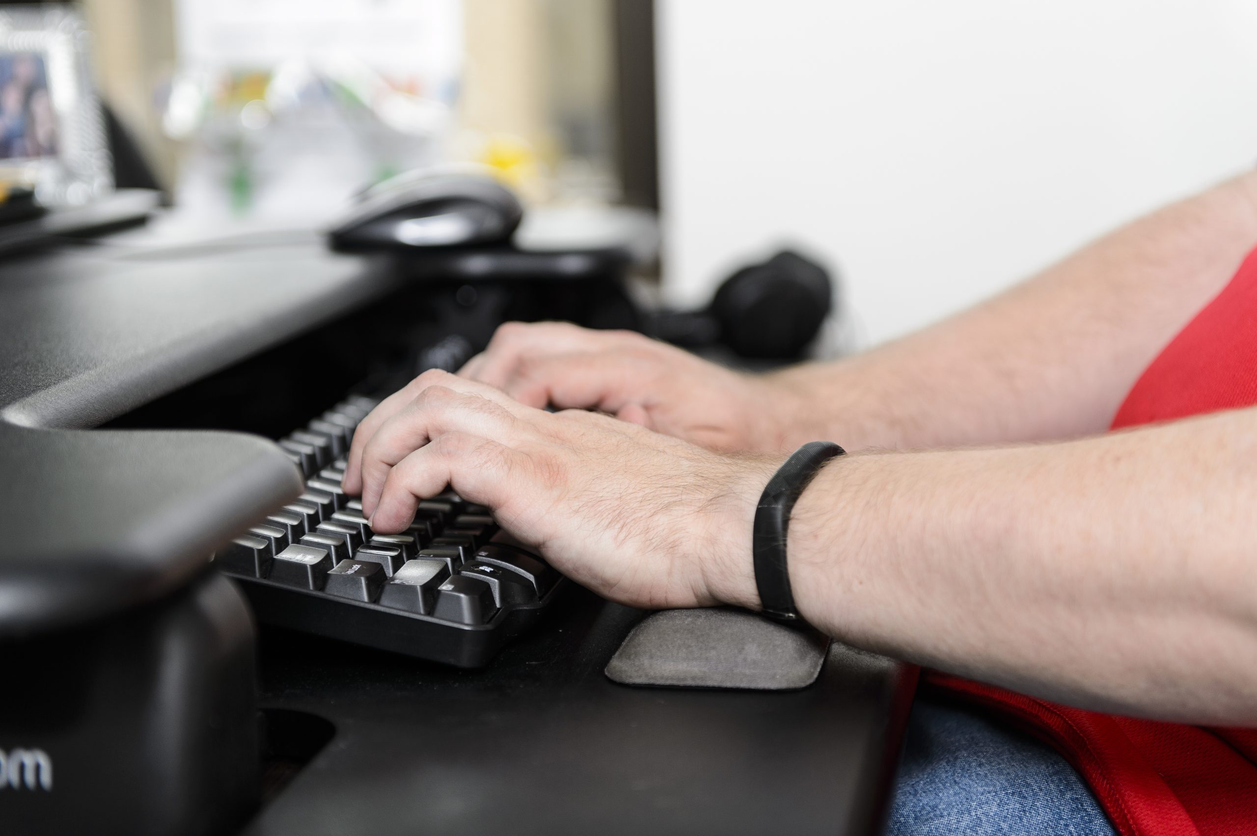 Hands typing on a keyboard
