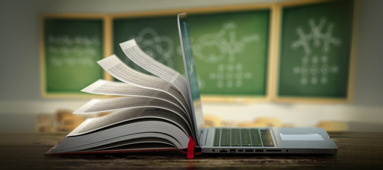 Half of an open book merged with half of an open laptop