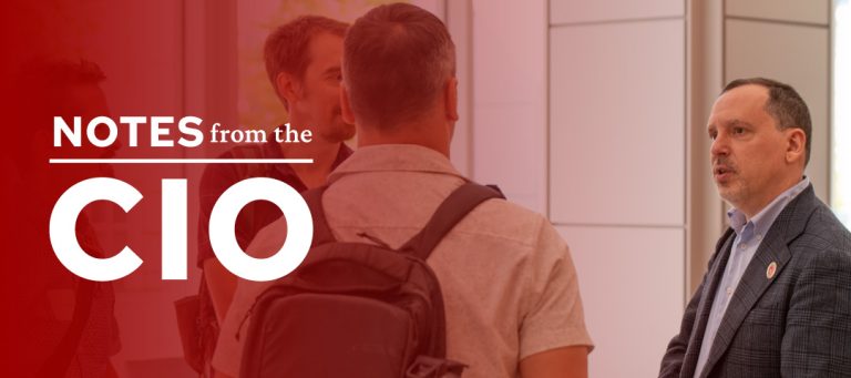 Notes from the CIO with an image of Didier Contis speaking with UW employees