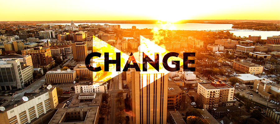 The word "Change" write over two right facing arrows on a sunrise photo of the UW–Madison campus.