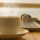 Cup of tea next to laptop