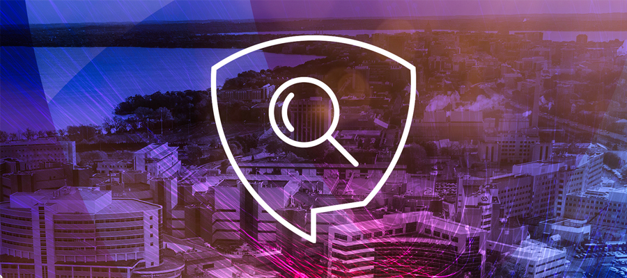 Cybersecurity Awareness Month logo with a magnifying glass