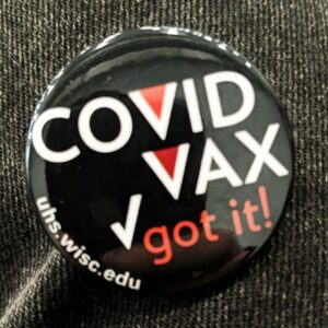 COVID Vax button from University Health Services
