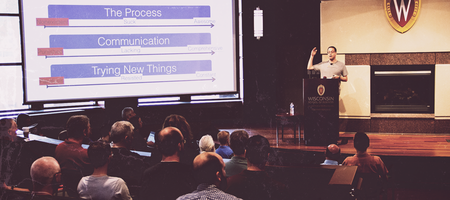 A speaker presents to a crowd at the IT Professionals Conference 2019