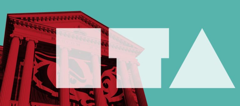 The letters "ITA" superimposed over an image of Bascom Hall