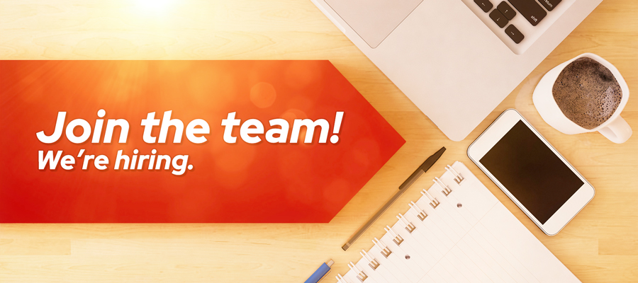 "Join the team! We're hiring." copy next to a coffee and laptop