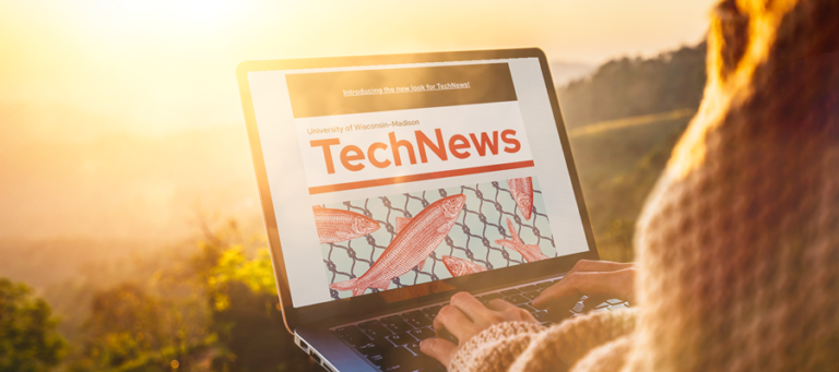 A person sitting with their laptop open to the new TechNews redesign overlooking a sunrise landscape on a soft dewy morning.