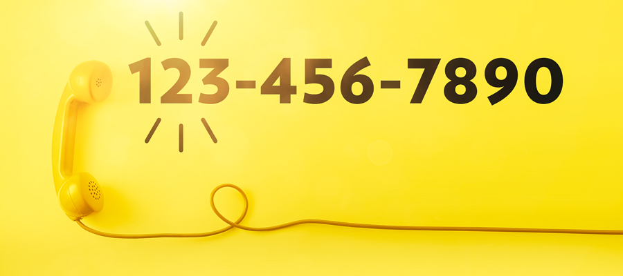 Yellow phone with 10 digit phone number