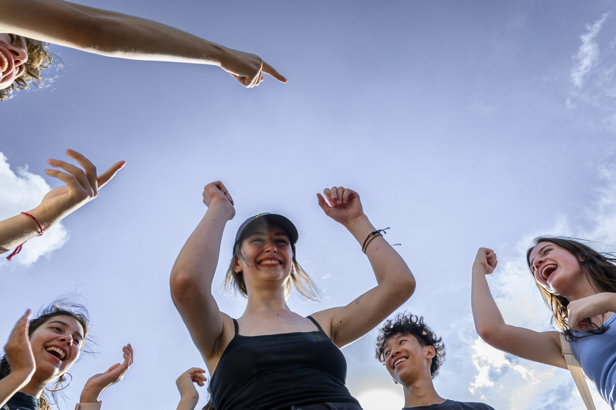 Students enthusiastically cheering each other