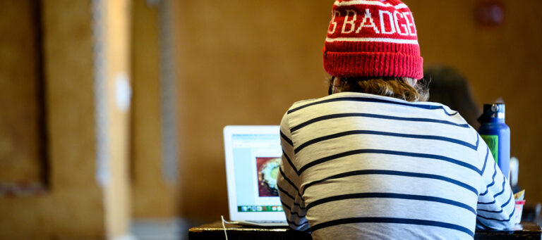 Student studying on a laptop