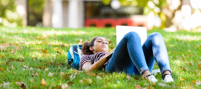 Student with laptop on Bascom Hill