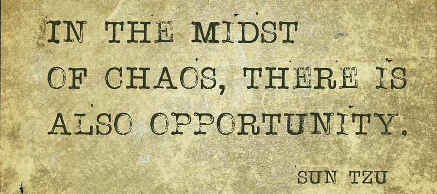 Parchment paper that reads, "In the midst of change, there is also opportunity. –Sun Tzu"