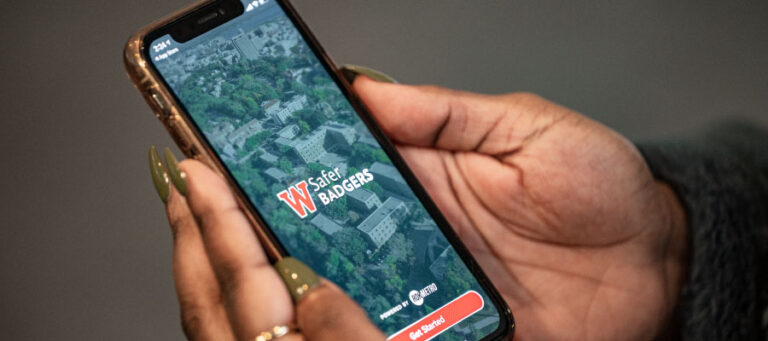 Person using Safer Badgers app on a smartphone