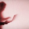 Shadowy figure with laptop